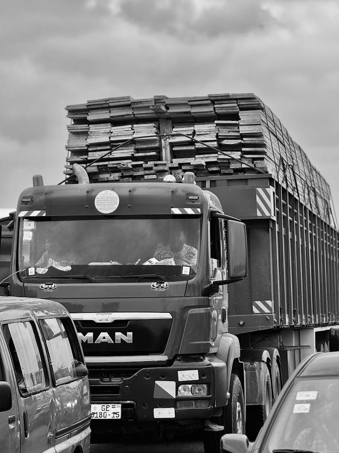 Heavy traffic scene with a loaded truck in Lapaz, Greater Accra Region, Ghana.
